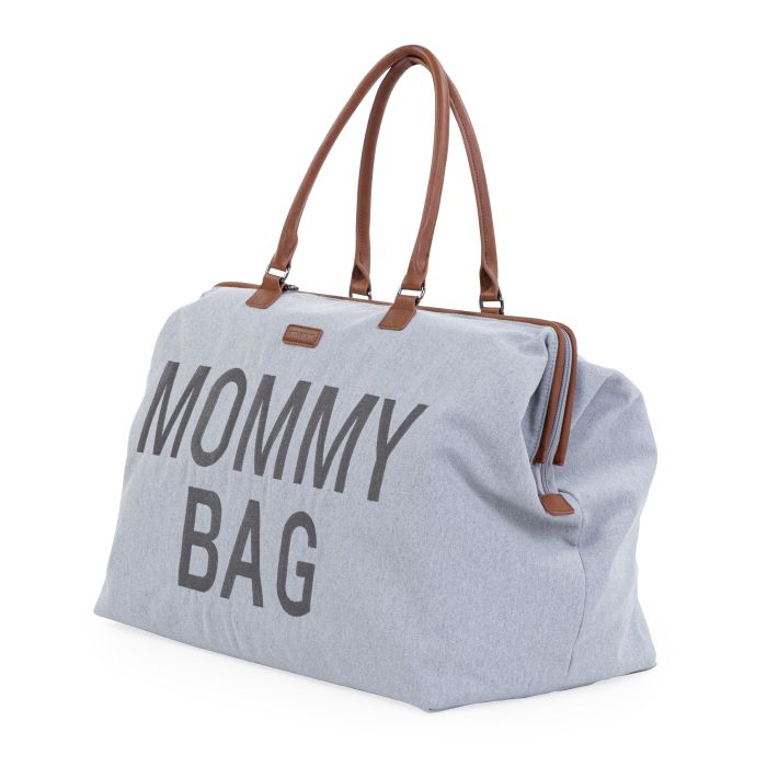 Grijze Mommy Bag verzorgingstas met bruine handvatten en ritssluiting, schuin van voren gezien.