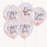 Vijf transparante 'Baby Girl' ballonnen met roze en goudkleurige confetti en lintjes tegen een witte achtergrond.