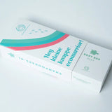 Cadeaudoos voor baby body bar en shampoo bar met turquoise en roze bogen, gedeeltelijk opengeschoven